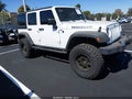 2011 Jeep Wrangler Unlimited — photo 1 of 17 | VIN 1J4BA3H18BL602807