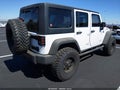 2011 Jeep Wrangler Unlimited — photo 4 of 17 | VIN 1J4BA3H18BL602807