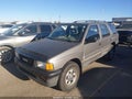 1997 Isuzu Rodeo — photo 2 of 11 | VIN 4S2CM58V0V4322446