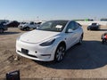 2023 Tesla Model Y — photo 2 of 20 | VIN 7SAYGDEE3PA100048