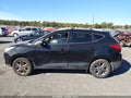 2014 Hyundai Tucson — photo 14 of 16 | VIN KM8JUCAG2EU940480