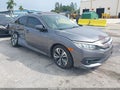 2018 Honda Civic — photo 1 of 16 | VIN 19XFC1E31JE002780