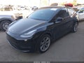2022 Tesla Model Y — photo 2 of 18 | VIN 7SAYGAEE0NF486796