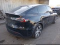 2022 Tesla Model Y — photo 4 of 18 | VIN 7SAYGAEE0NF486796