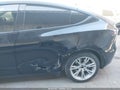 2022 Tesla Model Y — photo 6 of 18 | VIN 7SAYGAEE0NF486796