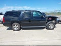 2012 Chevrolet Suburban 1500 — photo 13 of 16 | VIN 1GNSCJE04CR211272
