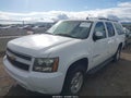 2014 Chevrolet Suburban 1500 — photo 2 of 16 | VIN 1GNSCJE09ER209696