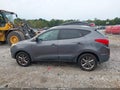 2014 Hyundai Tucson — photo 14 of 16 | VIN KM8JU3AG1EU870132