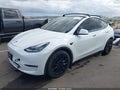 2021 Tesla Model Y — photo 2 of 19 | VIN 5YJYGAEE9MF212721