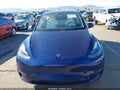 2023 Tesla Model Y — photo 13 of 19 | VIN 7SAYGDEE3PF902084