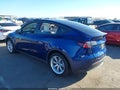 2023 Tesla Model Y — photo 3 of 19 | VIN 7SAYGDEE3PF902084