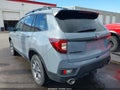 2023 Honda Passport — photo 3 of 16 | VIN 5FNYF8H66PB000783