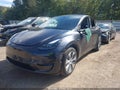 2024 Tesla Model Y — photo 2 of 16 | VIN 7SAYGDEE6RA271346