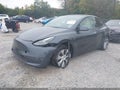 2023 Tesla Model Y — photo 2 of 23 | VIN 7SAYGAEE5PF645170