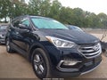 2017 Hyundai Santa Fe — photo 13 of 16 | VIN 5NMZUDLB3HH018486