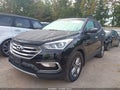 2017 Hyundai Santa Fe — photo 2 of 16 | VIN 5NMZUDLB3HH018486