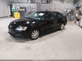 2014 Volkswagen Jetta — photo 2 of 17 | VIN 3VW2K7AJ7EM313504