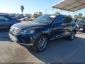 2016 Volkswagen Touareg — photo 2 of 16 | VIN WVGEP9BP9GD001050
