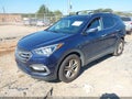 2017 Hyundai Santa Fe — photo 2 of 16 | VIN 5XYZU3LB6HG499046