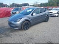 2025 Tesla Model Y — photo 2 of 18 | VIN 7SAYGDEE3SF285763