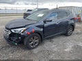 2015 Hyundai Santa Fe — photo 2 of 13 | VIN 5XYZU3LB5FG235815