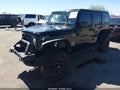 2012 Jeep Wrangler Unlimited — photo 2 of 17 | VIN 1C4HJWEG1CL215933