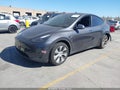 2023 Tesla Model Y — photo 2 of 17 | VIN 7SAYGAEEXPF871902