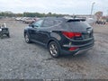 2017 Hyundai Santa Fe — photo 3 of 11 | VIN 5NMZUDLB8HH005782