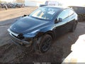 2025 Tesla Model Y — photo 2 of 18 | VIN 7SAYGDED2SA371537