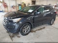 2016 Hyundai Santa Fe — photo 2 of 18 | VIN 5XYZTDLB5GG374949