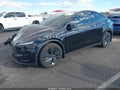 2026 Tesla Model Y — photo 2 of 15 | VIN 7SAYGDEE4TF357538