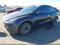 2026 Tesla Model Y — photo 2 of 16 | VIN 7SAYGDED1TF713712