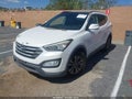 2015 Hyundai Santa Fe — photo 2 of 12 | VIN 5XYZU3LB1FG279584