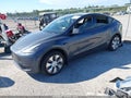 2023 Tesla Model Y — photo 2 of 15 | VIN 7SAYGDEE4PA122432