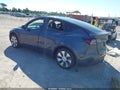 2023 Tesla Model Y — photo 3 of 15 | VIN 7SAYGDEE4PA122432