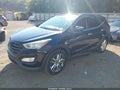 2014 Hyundai Santa Fe — photo 2 of 11 | VIN 5XYZW3LA8EG130038