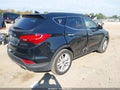 2014 Hyundai Santa Fe — photo 4 of 11 | VIN 5XYZW3LA8EG130038