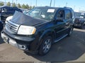 2014 Honda Pilot — photo 2 of 16 | VIN 5FNYF3H90EB009988