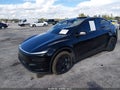 2026 Tesla Model Y — photo 2 of 18 | VIN 7SAYGDED2TF575517