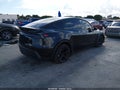 2026 Tesla Model Y — photo 4 of 18 | VIN 7SAYGDED2TF575517