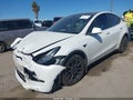 2023 Tesla Model Y — photo 2 of 15 | VIN 7SAYGDEE4PF614364