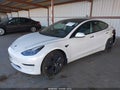 2022 Tesla Model 3 — photo 2 of 15 | VIN 5YJ3E1EA1NF302119
