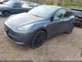 2022 Tesla Model Y — photo 2 of 15 | VIN 7SAYGDEE0NA009171