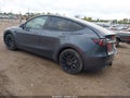 2022 Tesla Model Y — photo 3 of 15 | VIN 7SAYGDEE0NA009171