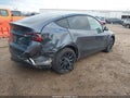 2022 Tesla Model Y — photo 4 of 15 | VIN 7SAYGDEE0NA009171