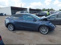 2023 Tesla Model Y — photo 11 of 14 | VIN 7SAYGDEE1PA165349