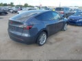 2023 Tesla Model Y — photo 4 of 14 | VIN 7SAYGDEE1PA165349