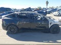 2023 Tesla Model Y — photo 11 of 15 | VIN 7SAYGAEE1PF888152