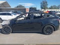 2023 Tesla Model Y — photo 13 of 15 | VIN 7SAYGAEE1PF888152