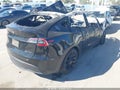 2023 Tesla Model Y — photo 4 of 15 | VIN 7SAYGAEE1PF888152
